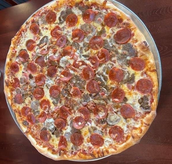 House specialty pizza pie fresh out of the oven